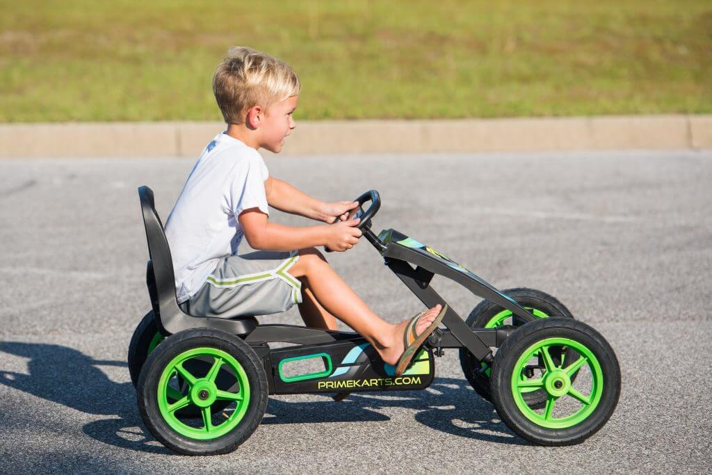Young boy riding Prime Karts Racer pedal-powered kart