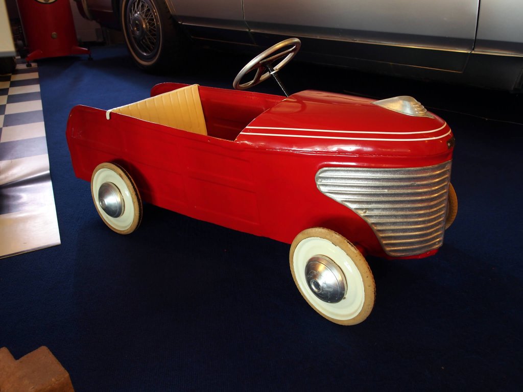 Red antique pedal car